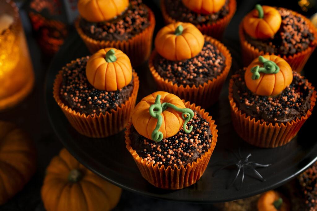 Halloween themed sweet potato cupcakes with pumpkins on top